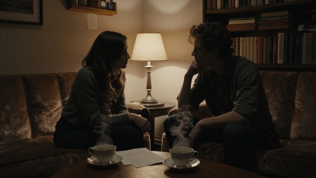 Two people sit in quiet companionship on a velvet sofa in a Paris apartment, lit by a single lamp.